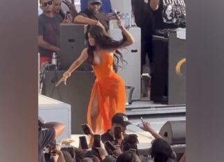 Cardi B threw her microphone at a concertgoer who tossed drink at her while performing on stage