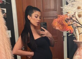 See Travis Barker Cuddled Up on Pregnant Kourtney Kardashian's Bump