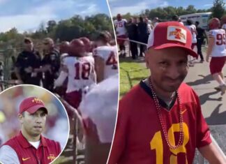 Iowa State coach Matt Campbell attempts to rush heckling fan