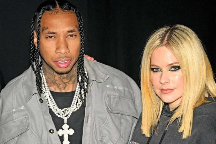 Avril-Lavigne-tyga-kiss-01-030623-6d2b7ab1e66846d5a1265f0416d98eb4.jpg