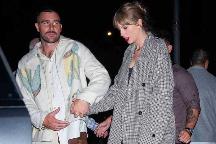 TAYLOR-TRAVIS-holding-hands-101523-01-bdafa91904d04102b0f3700bd41b57cc.jpg