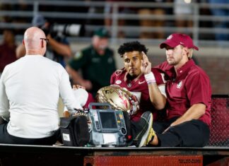 Jordan Travis carted off field after suffering gruesome leg injury