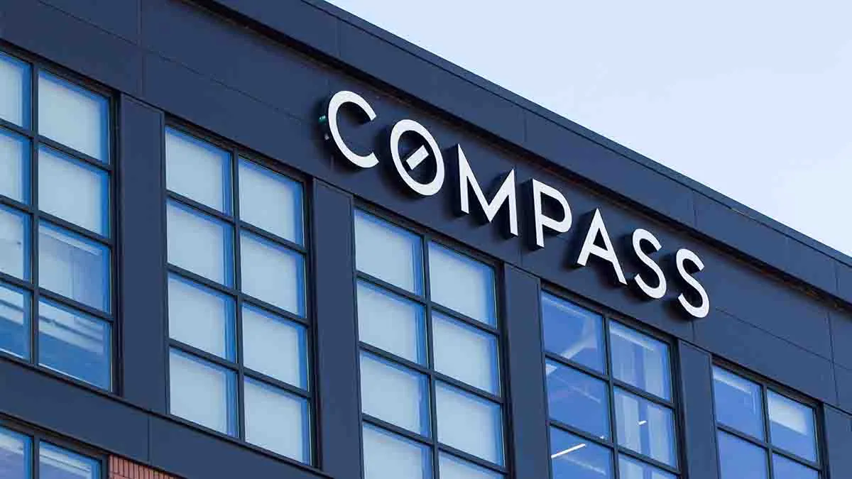Compass cuts losses in Q3, addresses commission lawsuit threat