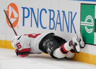Jack Hughes suffers scary upper-body injury in Devils win