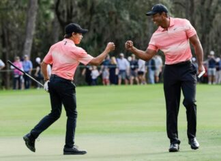 Tiger Woods walks 18 holes at PNC Championship pro-am
