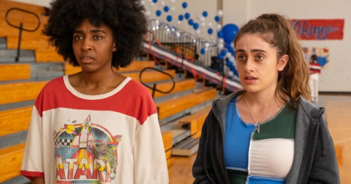 Ayo-Edebiri-and-Rachel-Sennott-stand-near-gym-bleachers-together-in-Bottoms.jpg