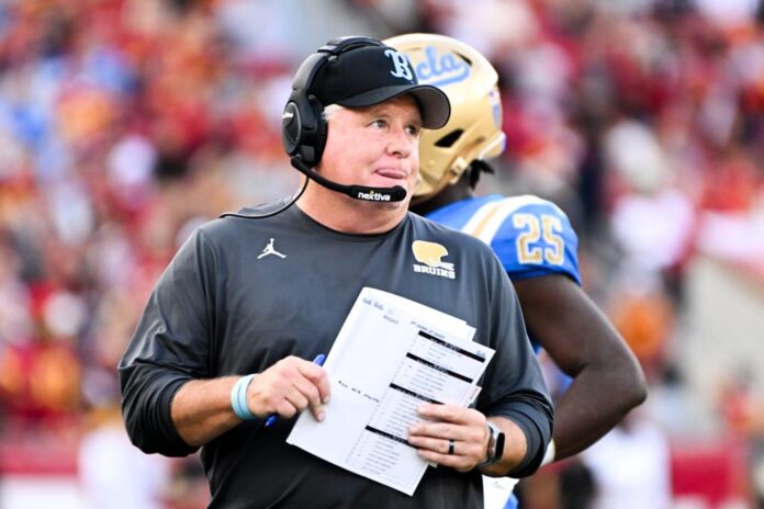 UCLA-Bruins-head-coach-Chip-Kelly-watches-from-the-sidelines-during-the-first-half-against-the-USC-Trojans-e1702674185288.jpg