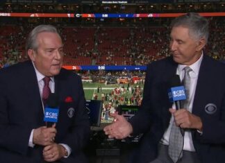 Brad Nessler awkwardly ignores Gary Danielson’s handshake attempt