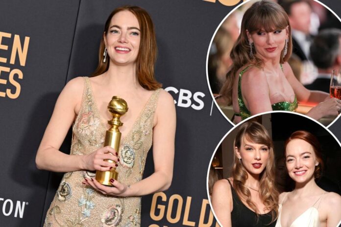 emma-stone-poses-award-best-74577748.jpg